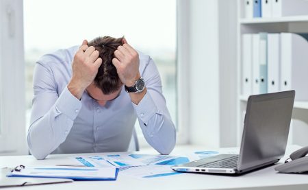 Stressed man with papers