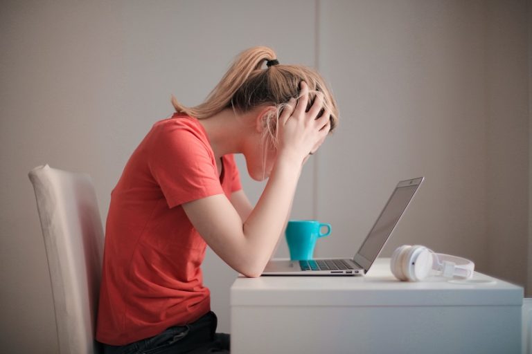 Woman looking at her laptop