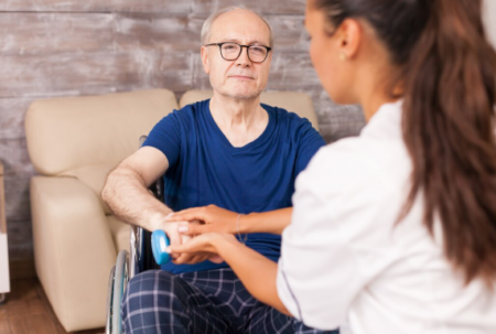 Daily Tips for Patients after Parkinson’s Disease Treatment Parkinson’s disease patient doing light exercise with caregiver support to improve mobility and daily functioning.