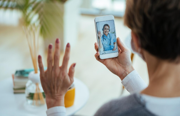 Patient using online chat on laptop to communicate with healthcare provider for quick medical support and guidance.