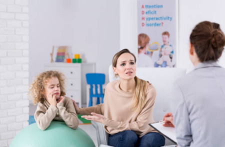 Why Parents Should Know About Applied Behavior Therapy Early Support Child with autism engaging in ABA therapy session with therapist using interactive learning tools.