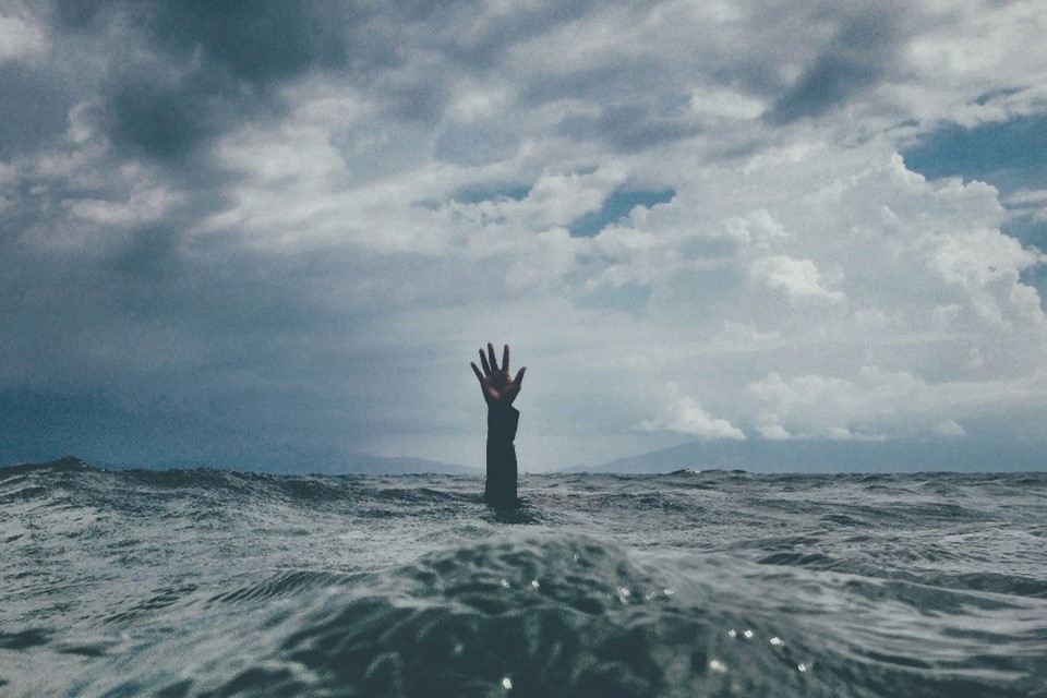 Person practicing mindfulness and taking a break to manage stress and build mental resilience in a busy daily life.