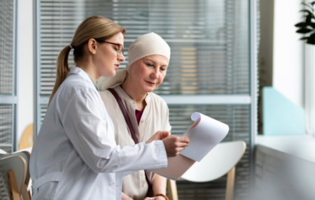 How Does a Delayed Cancer Diagnosis Affect a Patient’s Survival Odds? Doctor reviewing cancer scan results with a concerned patient after a delayed cancer diagnosis