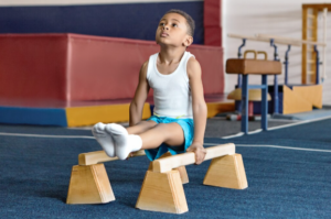 How Gross Motor Skill Exercises Support Strength and Coordination? Child developing balance and coordination through gross motor activities