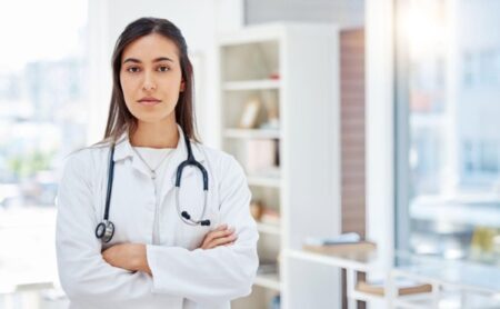 OBGYN doctor about reproductive health symptoms during medical appointment