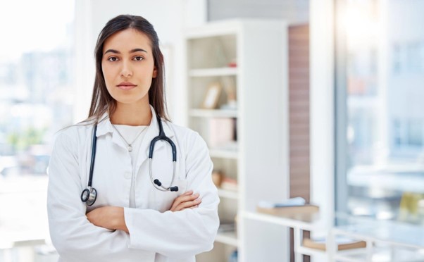 OBGYN doctor about reproductive health symptoms during medical appointment
